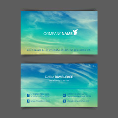 Two-sided horizontal business cards with realistic turquoise-yellow sky and spindrift clouds. The image can be used to design a business card.