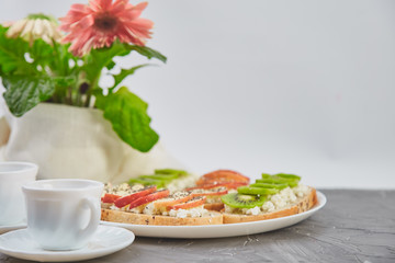 Healthy breakfast coffee, bouquet of flower and toasts