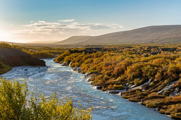 The beautiful Hraunfossar in Iceland, in vibrant autumn colors