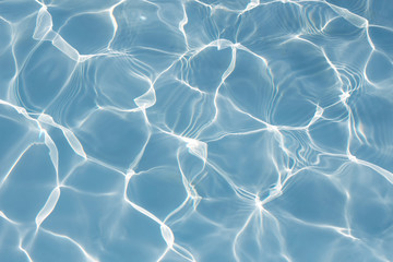 Texture of water in swimming pool for background