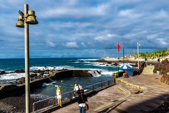 Puerto de la Cruz, Tenerife, Canaria - Strong wind and big waves and the red flag, it is bathing prohibited in the natural swimming pool located on the coast of Puerto del la Cruz.