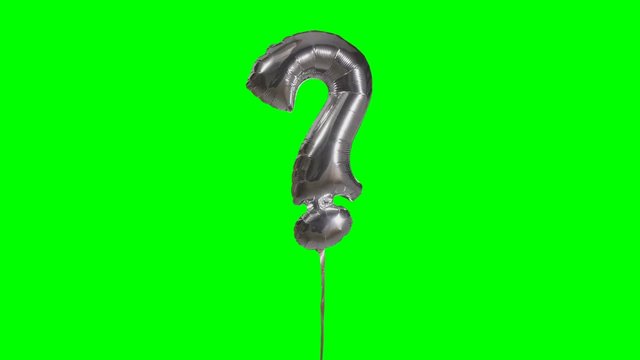 Sign symbol question mark from alphabet helium silver balloon floating on green screen