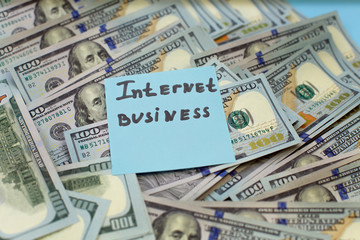 Online or internet business and many US dollar banknotes. Profits from the sale of online.