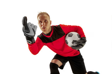 One male soccer player goalkeeper pointing away and screaming isolated on white background. Appeal...