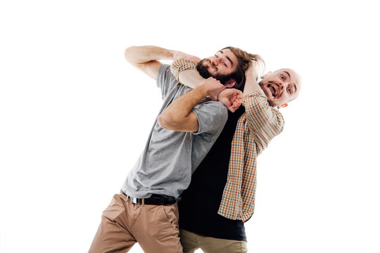 Young man in  shirt strangling a young man, aggression, mischief, isolated white background, copy space
