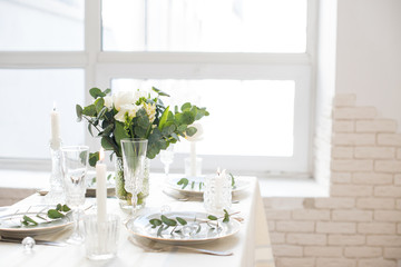 Fototapeta na wymiar Beautiful festive table setting with elegant white flowers and cutlery, dinner table decoration 
