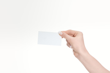 partial view of woman holding empty card isolated on white