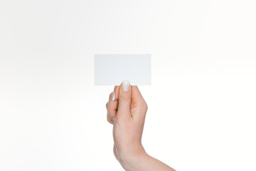 Obraz premium partial view of woman holding blank and empty card isolated on white