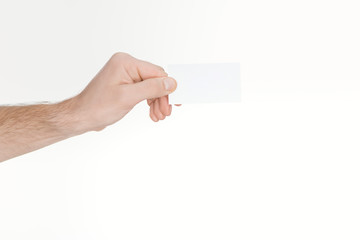 Fototapeta premium cropped view of man holding blank and empty card with copy space