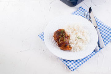 Chicken rolls with bacon and white rice. Delicious healthy food. Chinese and American food on a white background. Free space for the text.
