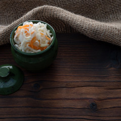 Homemade sauerkraut, pickled cabbage and carrots. Copy space.