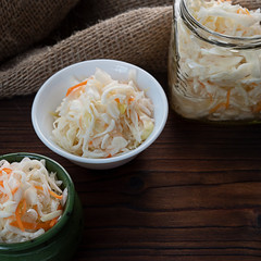Homemade sauerkraut, pickled cabbage and carrots. Copy space.