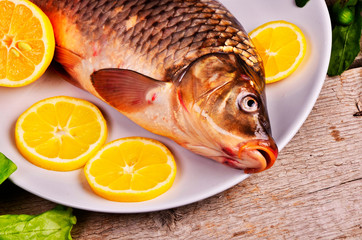 Fresh  fish and food ingredients on table