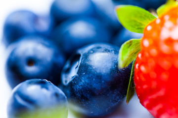 Raspberry blackberry and strawberries served on the plate. Nature and food concept image with fresh fruits on the plate