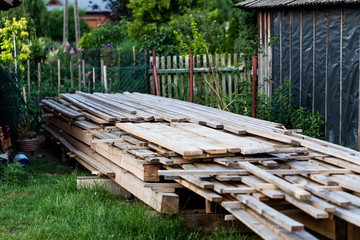 Pile of wooden boards for building and construction. Industrial wooden boards at the homeyard