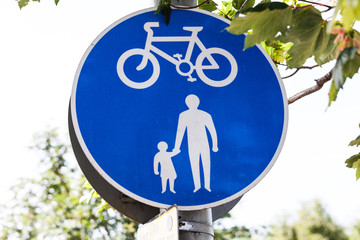 Road sign for bikes and pedestrians. Blue round traffic sign for safety