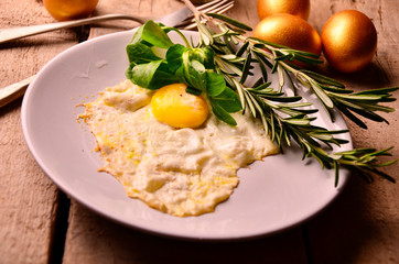 omelet of Golden eggs for Breakfast on wooden background