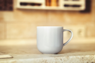 Gray mug on kitchen work surface