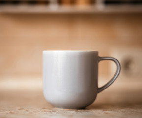 Gray mug on kitchen work surface