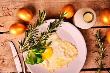 omelet of Golden eggs for Breakfast on wooden background