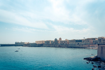 Naklejka premium Old buildings in seafront of Ortygia (Ortigia) Island, Syracuse, traditional architecture of Sicily, Italy.