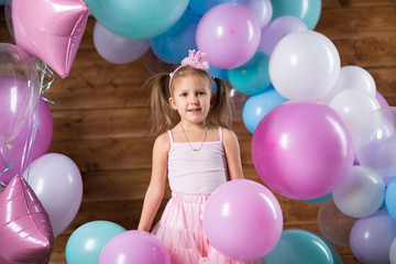 Girl child with balloons