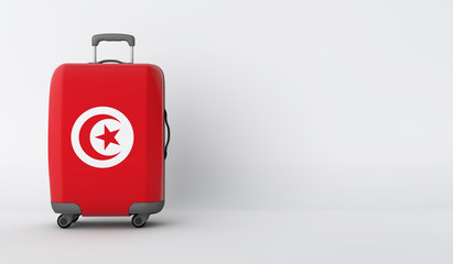 Travel suitcase with the flag of Tunisia. Holiday destination. 3D Render