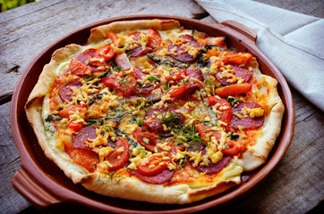 Delicious italian pizzas served on wooden table