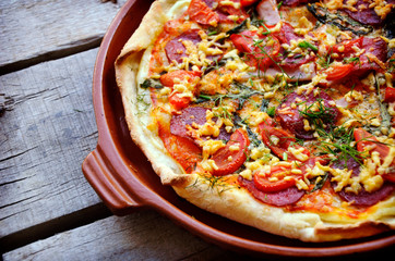 Delicious italian pizzas served on wooden table