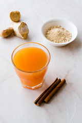 Jamu Healthy Asian Drink with Turmeric and Cinnamon Stick, Orange Juice