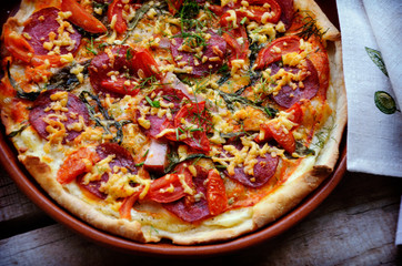 Delicious italian pizza served on wooden table