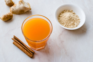 Jamu Healthy Asian Drink with Turmeric and Cinnamon Stick, Orange Juice