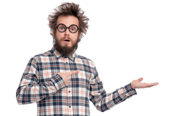 Crazy bearded Man with funny Haircut in eye Glasses showing something on empty palm of his hand. Happy Surprised guy in plaid shirt isolated on white. Emotions, business, advertising and signs concept