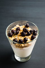 Healthy and tasty breakfast with muesli black currant and yogurt. Selective focus.