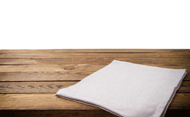 Empty tablecloth on wood table isolated on white background. Selective focus. Place for food. Top view. Mockup and template copy space.