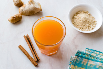 Jamu Healthy Asian Drink with Turmeric and Cinnamon Stick, Orange Juice