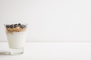 Healthy and tasty breakfast with muesli black currant and yogurt. Selective focus.