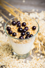 Healthy and tasty breakfast with muesli black currant and yogurt. Selective focus.