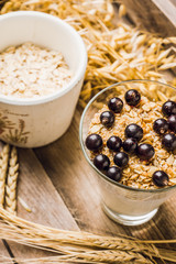 Healthy and tasty breakfast with muesli black currant and yogurt. Selective focus.