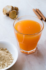 Jamu Healthy Asian Drink with Turmeric and Cinnamon Stick, Orange Juice