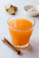 Jamu Healthy Asian Drink with Turmeric and Cinnamon Stick, Orange Juice