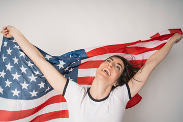 Happy woman with flag of the United States