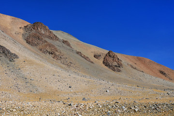 China, the structure of the Tibetan mountains on the way to lake Mershung in summer in clear weather