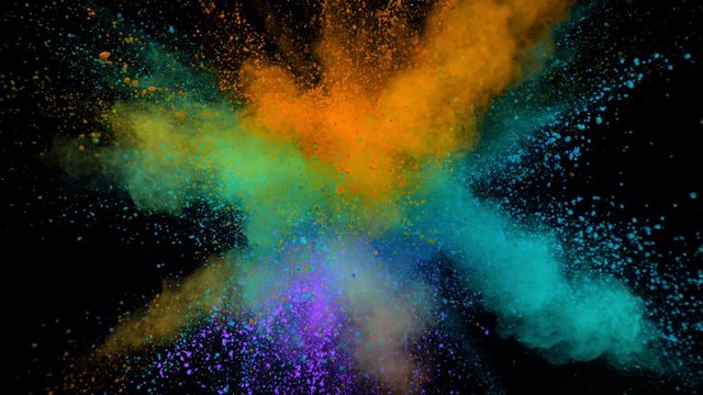 Super slowmotion shot of color powder explosion isolated on black background. S