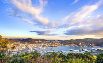 Business concept, modern cityscape of nagasaki dusk from mount inasa, the new top 3 nightview of the world, aerial view, copy space