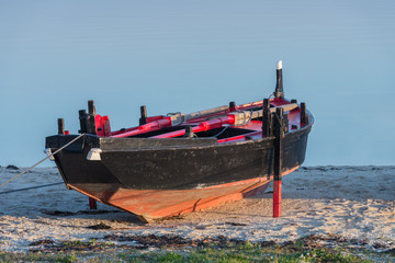 wooden fishing boat dries ashore