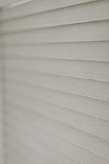 Fototapeta na wymiar white wooden shutters. selective focus
