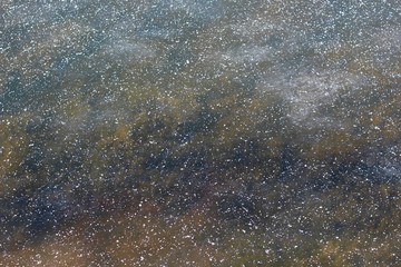 A close view of the icy frozen water surface.