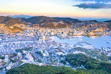 Business concept, modern cityscape of nagasaki dusk from mount inasa, the new top 3 nightview of the world, aerial view, copy space
