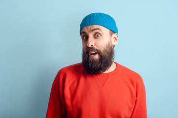 Naklejka premium Young emotional bearded man and facial expression concept
